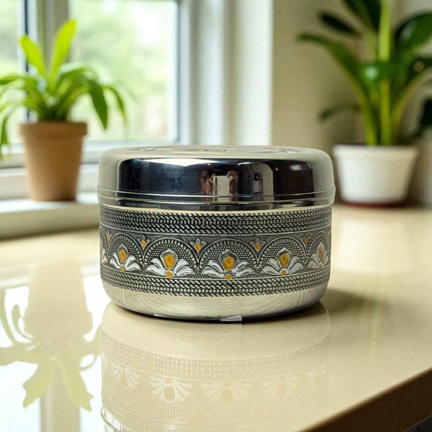 Mirror Antique Stainless Steel Half Dabba 4 litre with intricate floral design on a reflective surface