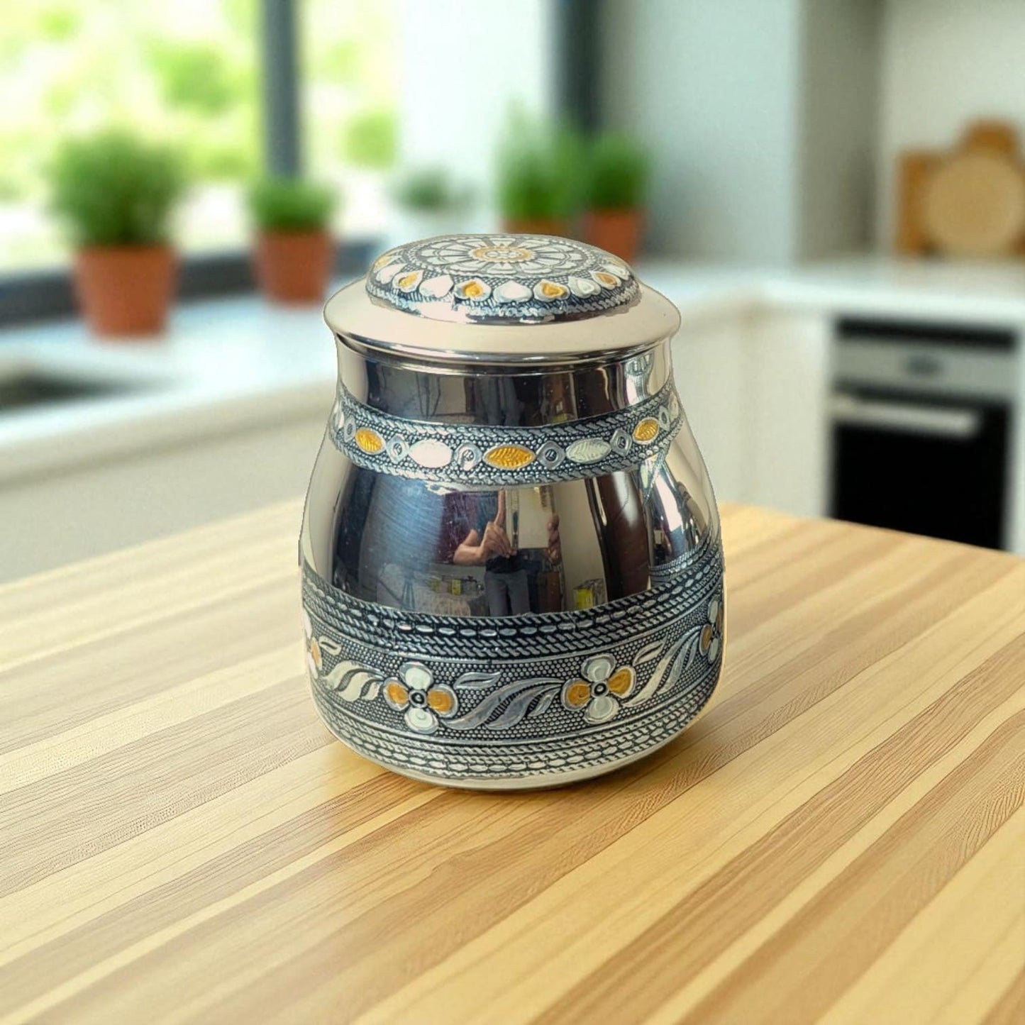 Mirror brand Antique Tea and Sugar Canisters with intricate floral design and metallic finish on wooden table