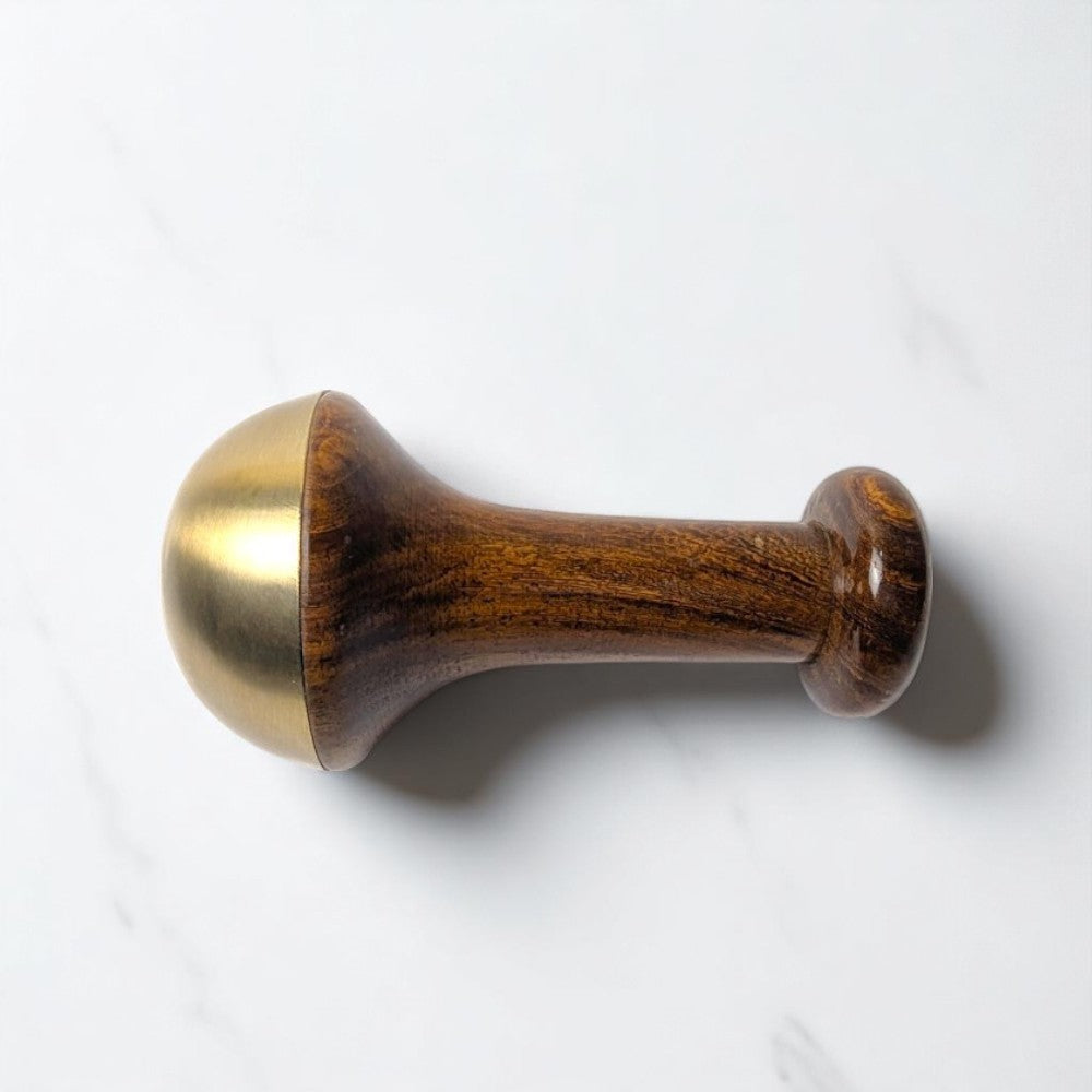 Large smooth kansa wand standing upright – bronze tool for kansa massage and full-body relaxation