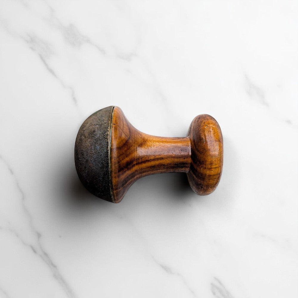 Kansyam Pure Bronze, Kansa wand Massager Tool with rough surface - angled view on marble