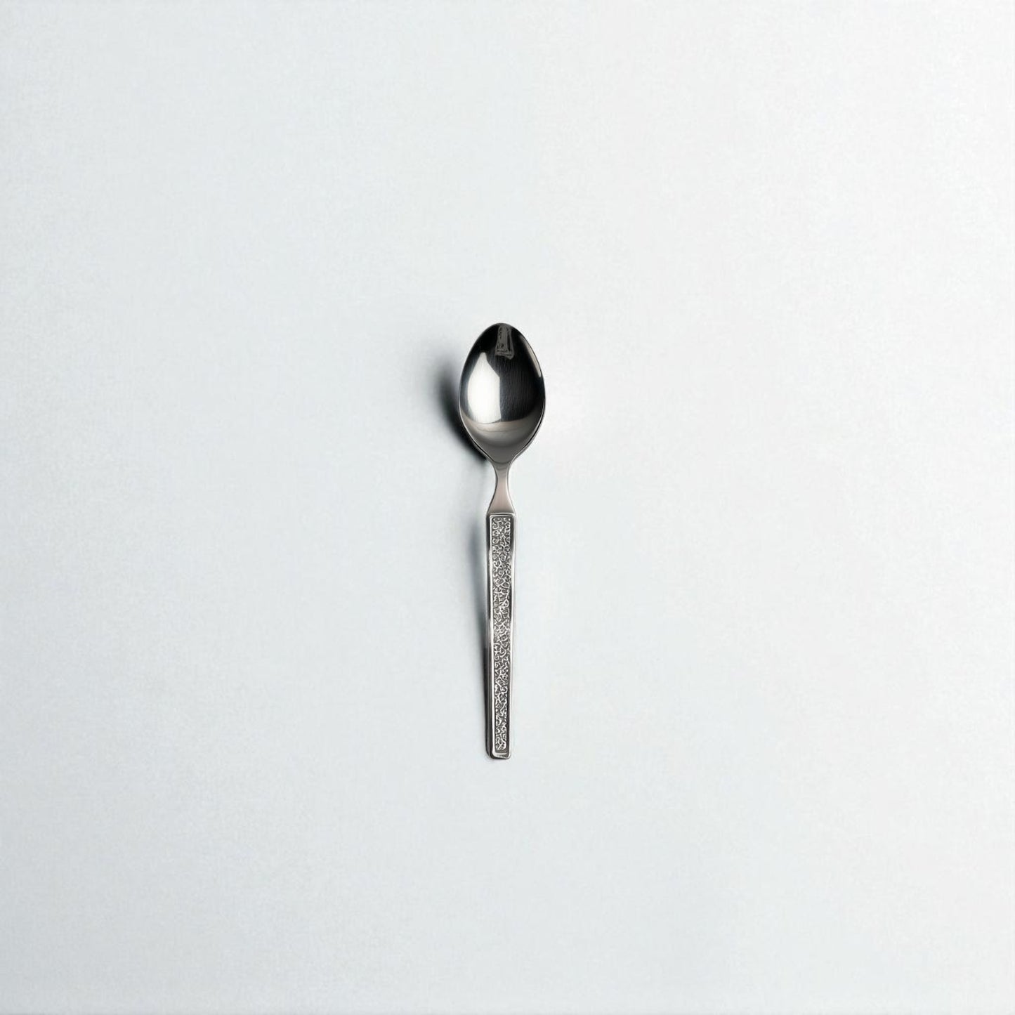 Kishco Cutlery Parma Coffee Spoon with textured handle and polished stainless steel finish