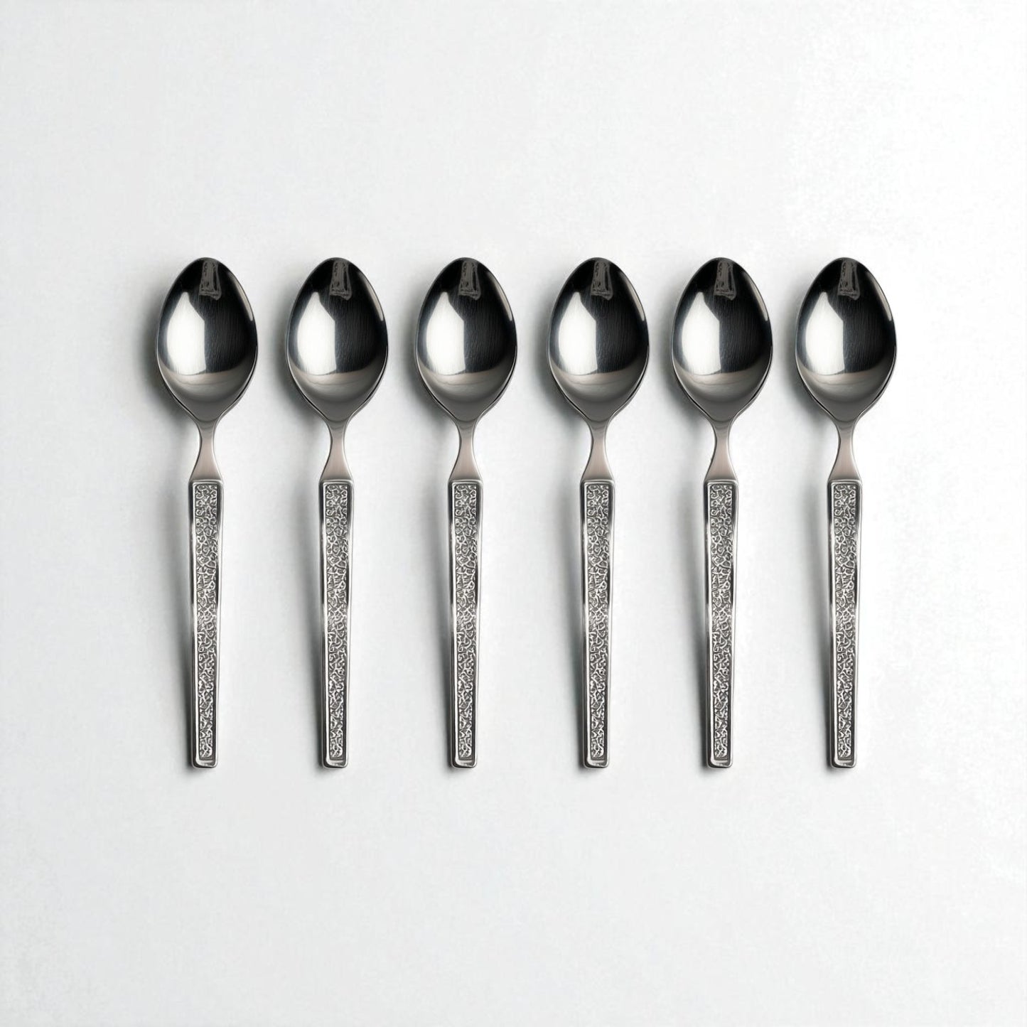 Set of six Kishco Cutlery Parma Tea Spoons with decorative textured handles on white background