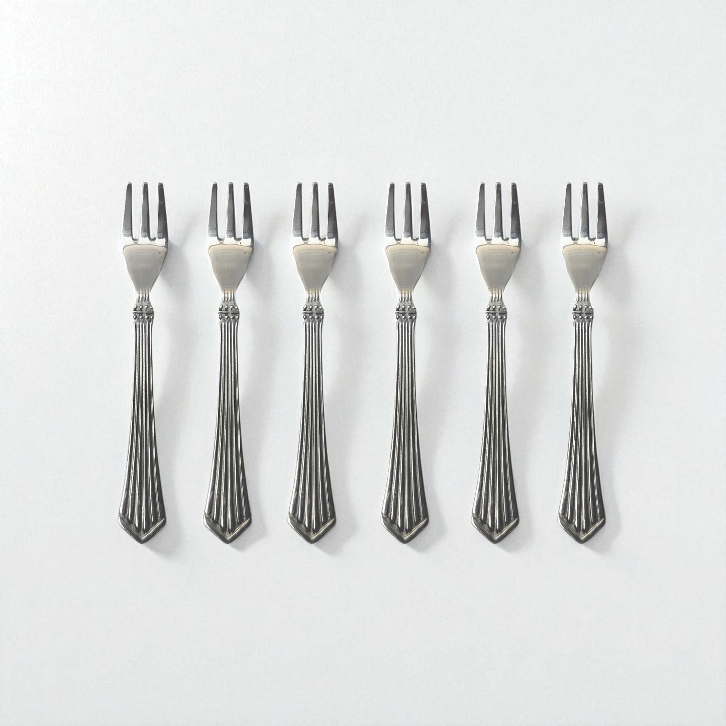 Set of six Kishco Cutlery Symphony Fruit Forks with elegant striped handles in stainless steel