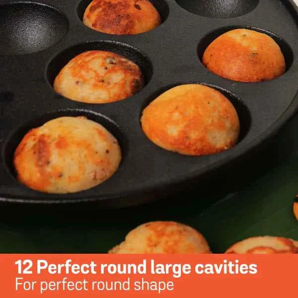 Meyer Cast Iron Appam Pan with 12 large round cavities cooking golden brown appams