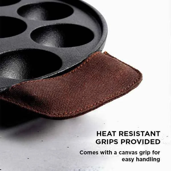 Meyer Cast Iron Appam Pan with heat resistant canvas grip for easy handling and cooking