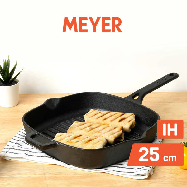 Meyer Cast Iron Grill Pan 25 cm with grilled bread slices on a wooden surface