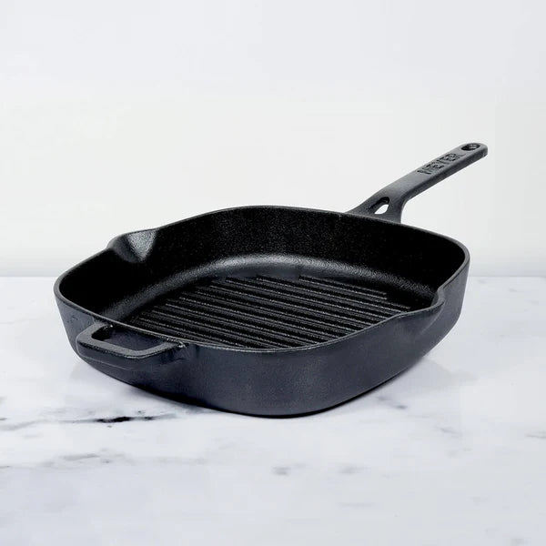 Meyer Cast Iron Grill Pan square shape with ridged cooking surface and handle on white marble background