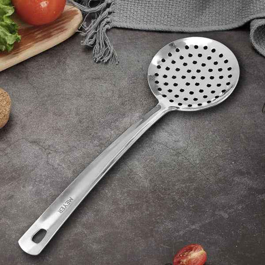Meyer Stainless Steel Skimmer with perforated head and ergonomic handle on kitchen counter