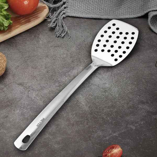Meyer Stainless Steel Slotted Turner with Long Handle on Dark Surface for Cooking