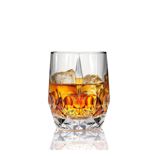 RCR Alkemist DOF crystal whiskey glasses, 346ml, with amber liquid and ice, showing faceted design 2