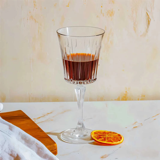 RCR Timeless Red Wine Glasses elegantly displayed with red wine and a slice of orange