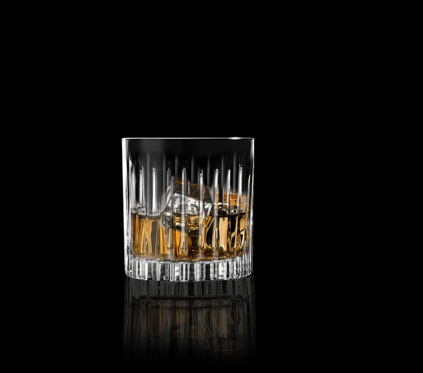 RCR Timeless whiskey glasses with a classic design, showcasing a drink with ice