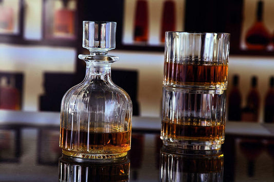RCR whiskey set including a crystal decanter and two whiskey glasses perfect for elegant entertaining