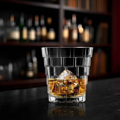 RCR Stack DOF crystal whiskey glass with whiskey on ice at a bar