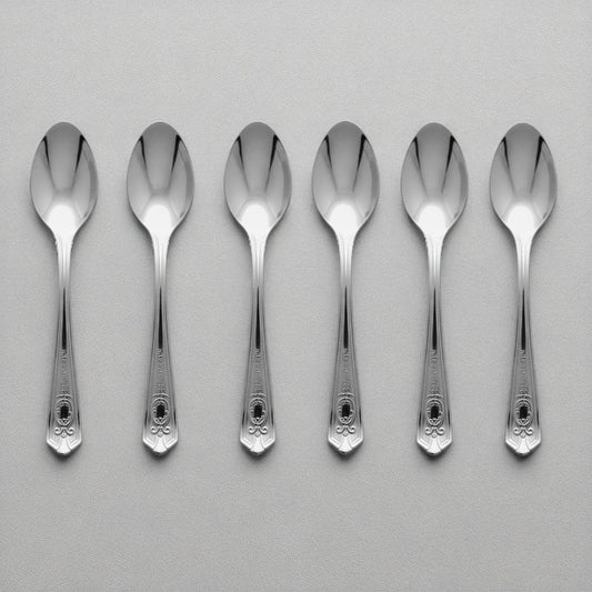 Set of 6 Kishco stainless steel baby spoons from the Festival collection, featuring ornate English handle detailing