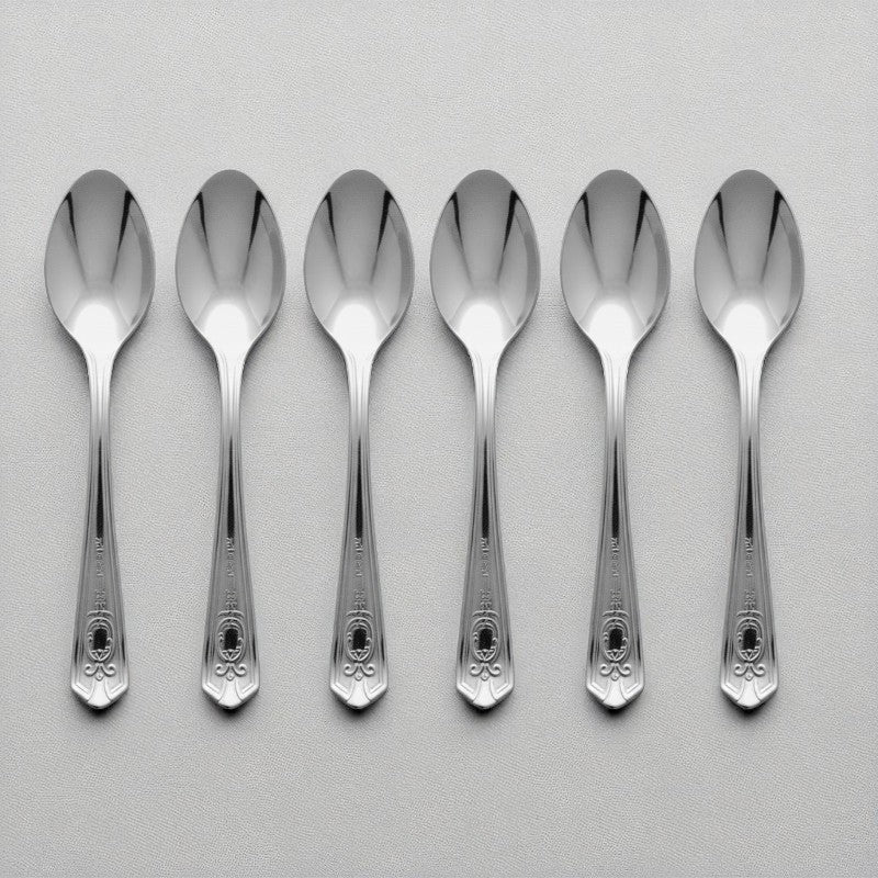 Set of 6 Kishco stainless steel dinner spoons from the Festival collection, featuring ornate English handle detailing.