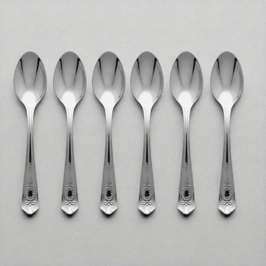 Set of 6 Kishco stainless steel dinner spoons from the Festival collection, featuring ornate English handle detailing.
