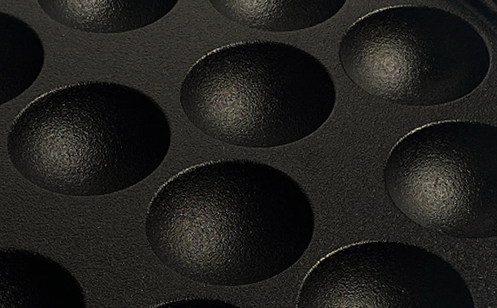 Meyer cast iron appam pan close up of pit