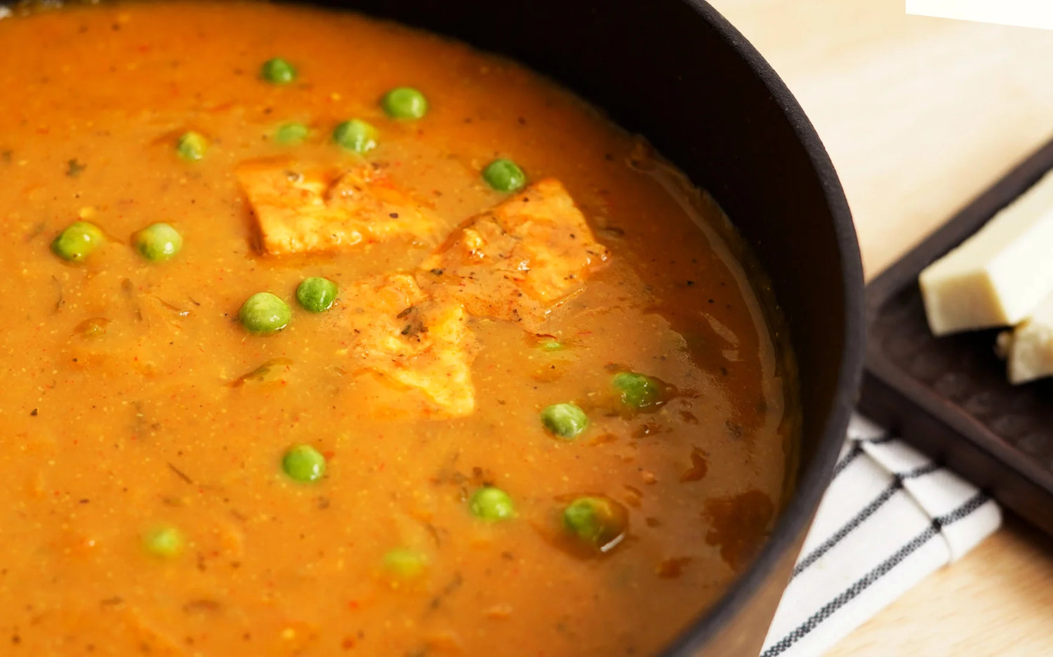 Sour cream soup with peas and paneer in Meyer cast iron sauteuse 