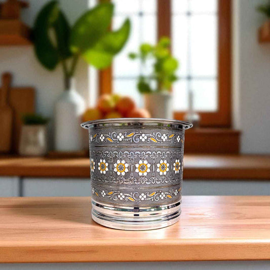 Antique Stainless Steel Pawali 7 litre with intricate floral design by Mirror placed on wooden kitchen counter