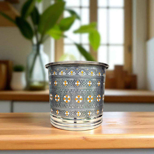 Antique Stainless Steel Pawali 9 litre with intricate floral design by Mirror on wooden surface