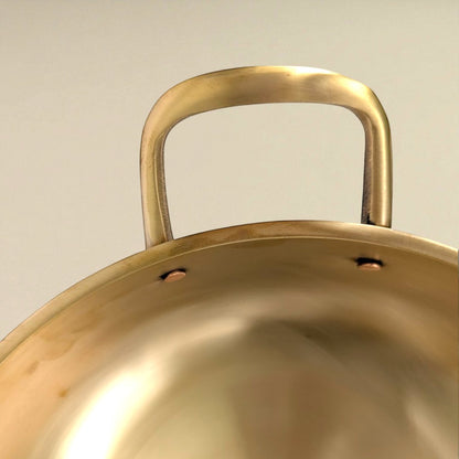 Close-up of Bronze Kansa Kadai handles showcasing the sturdy design and elegant finish