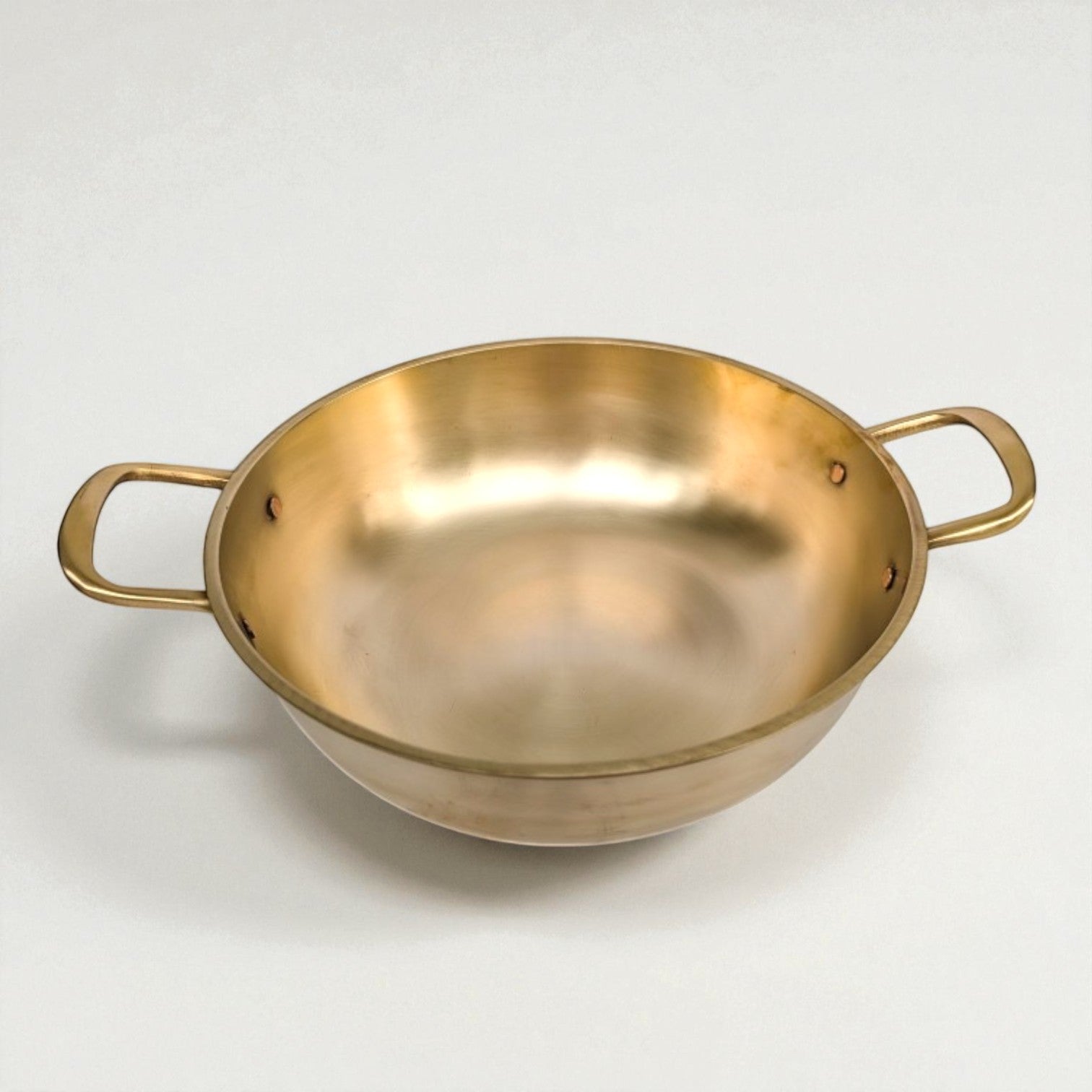 Bronze Kansa Kadai with sturdy handles for traditional Indian cooking and serving.