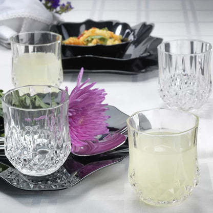 Cristal D'Arques Longchamp old fashioned 320ml glasses set on a black platter with drinks and floral decor
