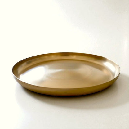 Elegant curve kansa thali in bronze finish, perfect for serving meals or decorative use