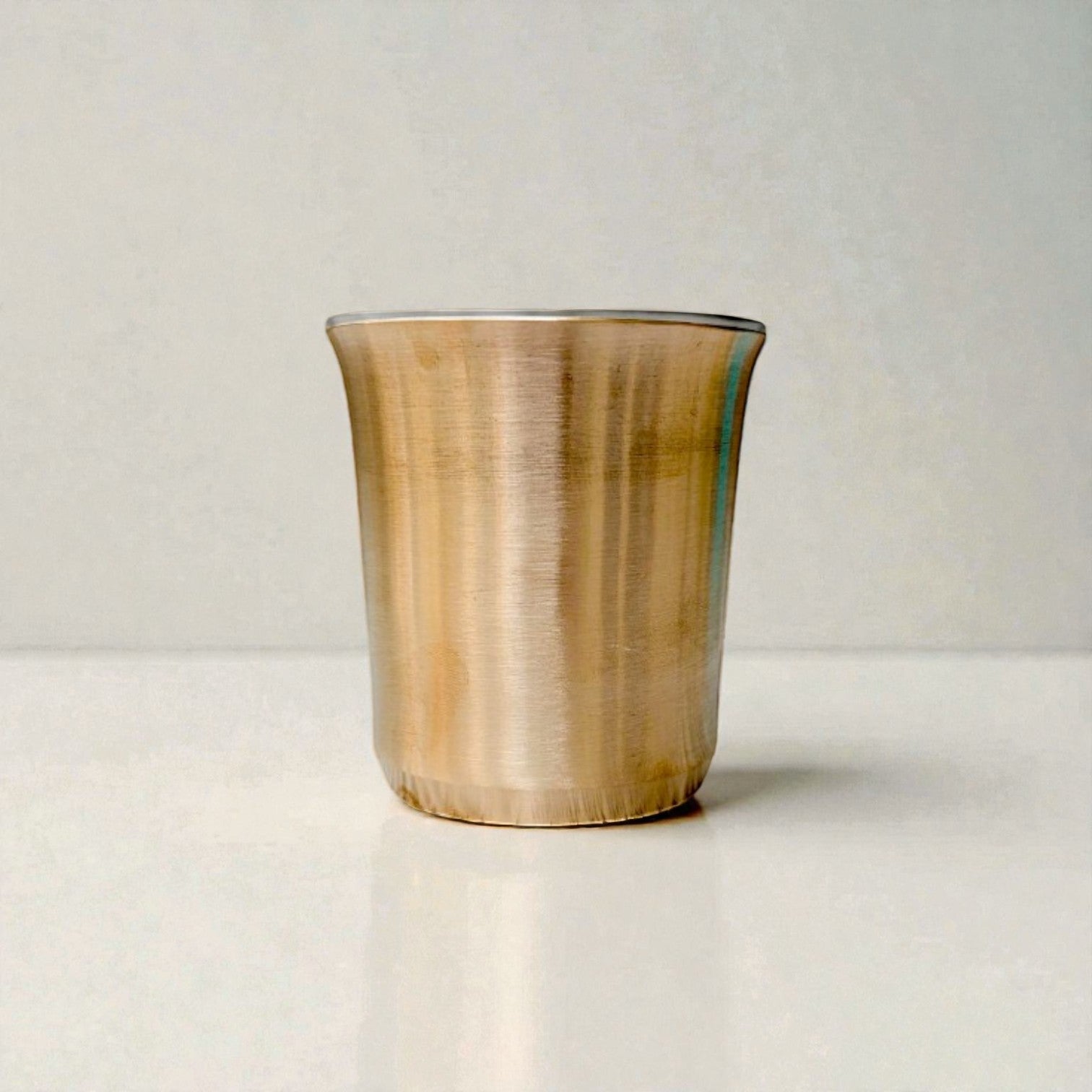 Kansa bengal glass bronze tumbler with a sleek design and shiny finish for modern dining
