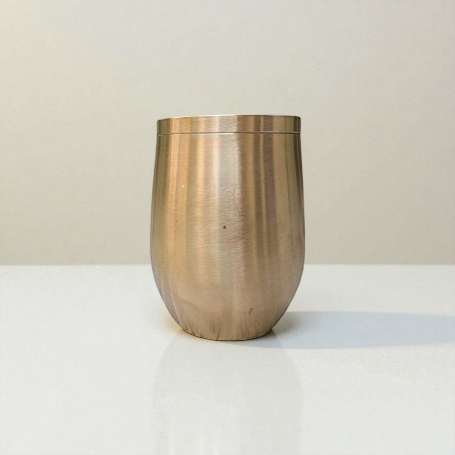 Kansa damru glass bronze elegantly designed with a smooth finish for everyday use.