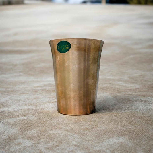 Front view of Kansyam kansa Chandi glass, 250ml in bronze color finish