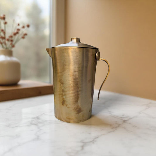 Kansyam Pure Bronze, Pipe Kansa Jug Large with Lid, 1500ml on a white marble angular view