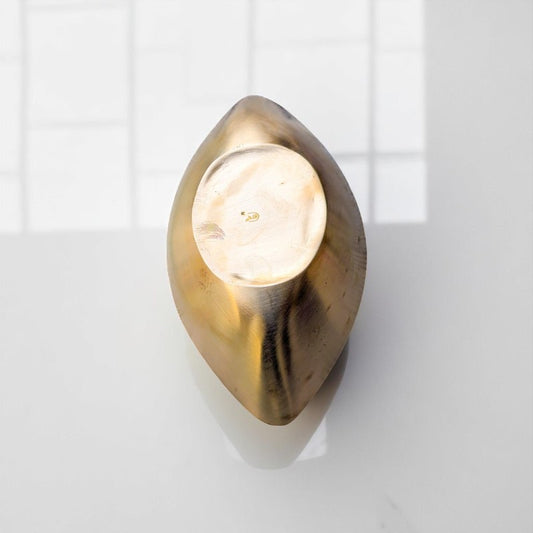 Top view of Kansyam pure bronze boat shape handi showing smooth metallic finish and unique design