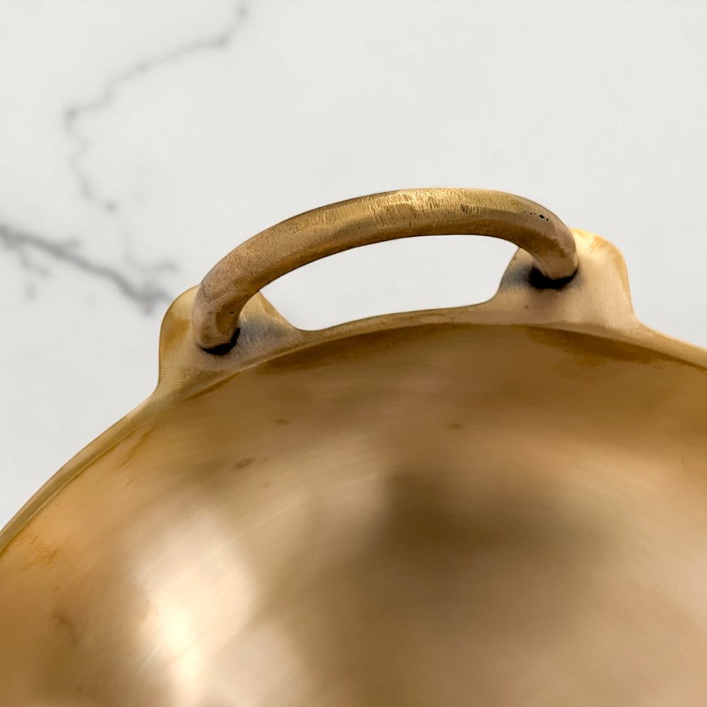 Close-up of the Kansyam Ruby kansa kadai handle, 4 litres, showcasing the sculpted loop design