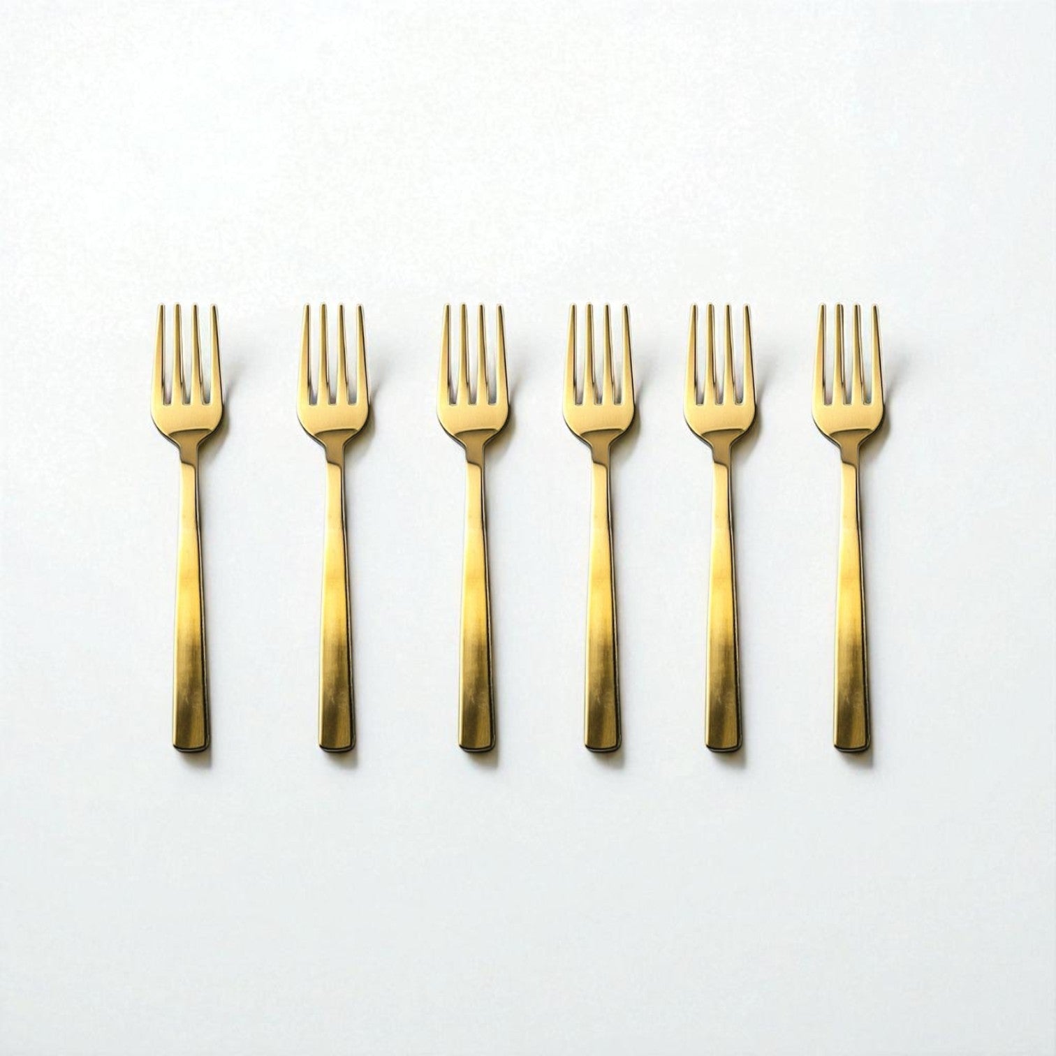 Set of six Kishco Cutlery Gold PVD Baby Forks with sleek modern design on white background