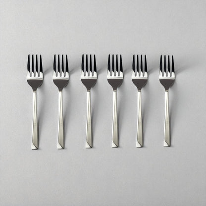 Set of six Kishco Cutlery Olympus Baby Forks with stainless steel polished finish on light background