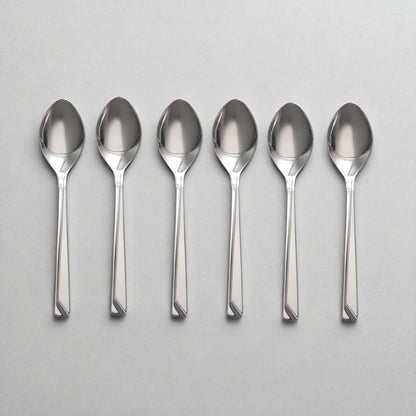 Set of six polished stainless steel Kishco Cutlery Olympus Baby Spoon arranged on a gray surface