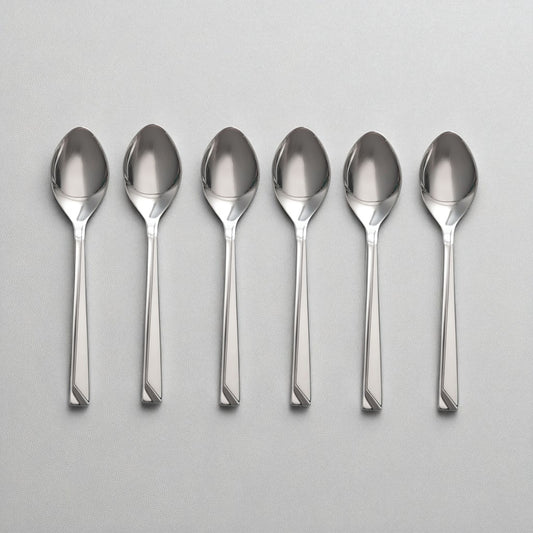 Set of six polished stainless steel Kishco Cutlery Olympus Baby Spoon arranged on a gray surface