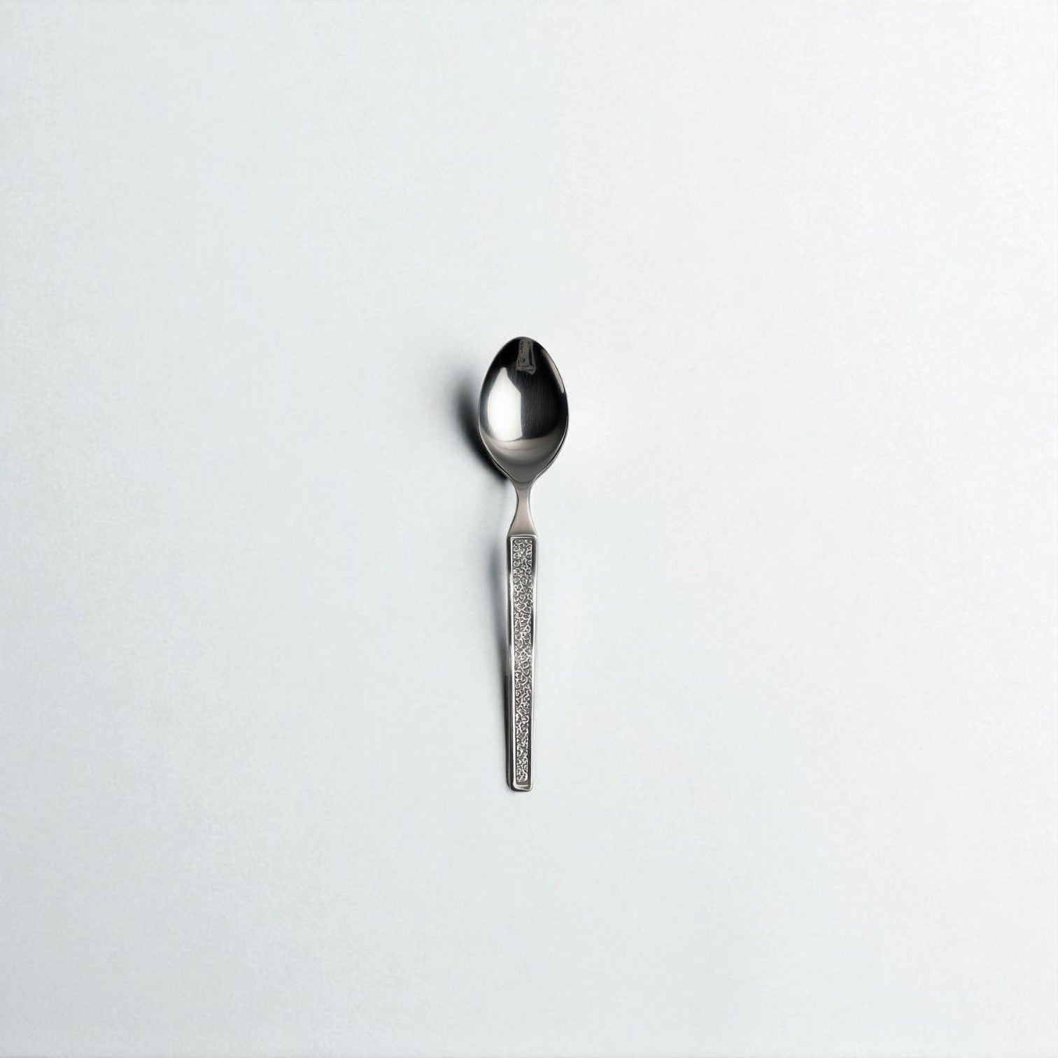 Kishco Cutlery Parma Coffee Spoon with textured handle and polished stainless steel finish