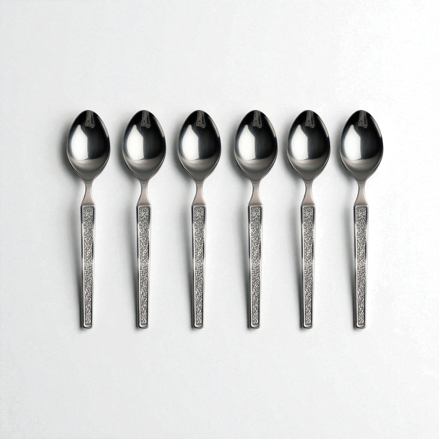 Set of six Kishco Cutlery Parma Tea Spoons with decorative textured handles on white background