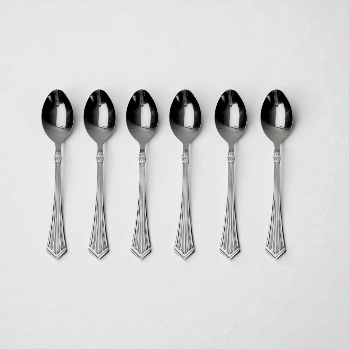 Set of six Kishco Cutlery Symphony Baby Spoons in polished silver finish with detailed handles