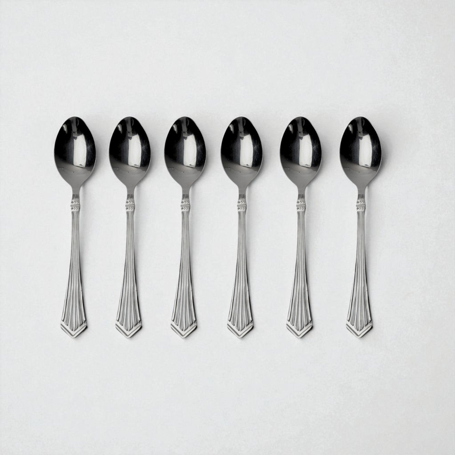 Set of six Kishco Cutlery Symphony Baby Spoons in polished silver finish with detailed handles