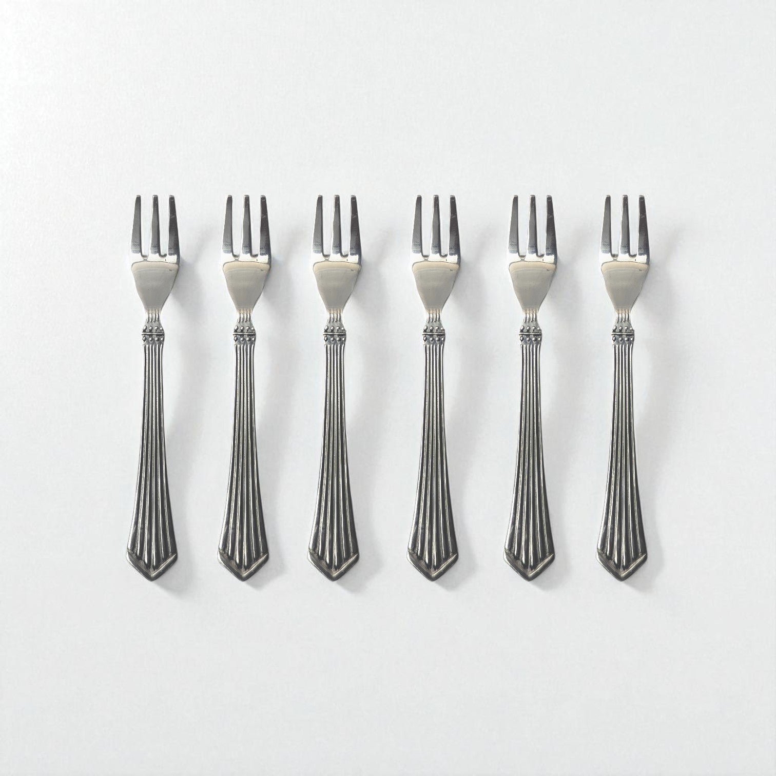 Set of six Kishco Cutlery Symphony Fruit Forks with elegant striped handles in stainless steel