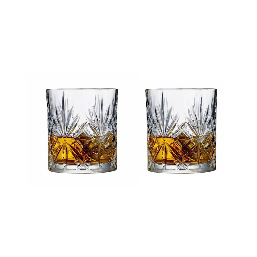 Two RCR Melodia DOF whiskey glasses with whiskey poured, close-up detail of the diamond-cut pattern.