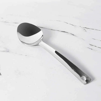 Meyer Stainless Steel Serving Spoon with polished finish and ergonomic handle on white surface