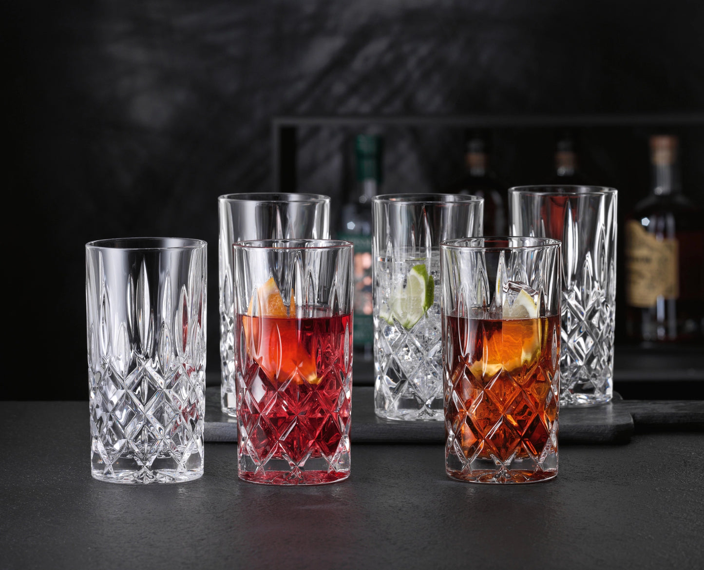Set of Nachtmann Noblesse Cocktail Glass Tumblers with colorful drinks garnished with fruit