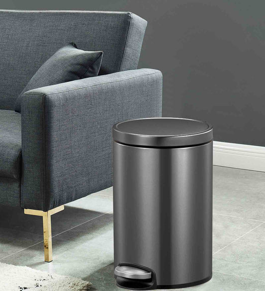 Obsessions Artistic Stainless Steel Dustbin 20 Ltr Black Steel beside sofa.
