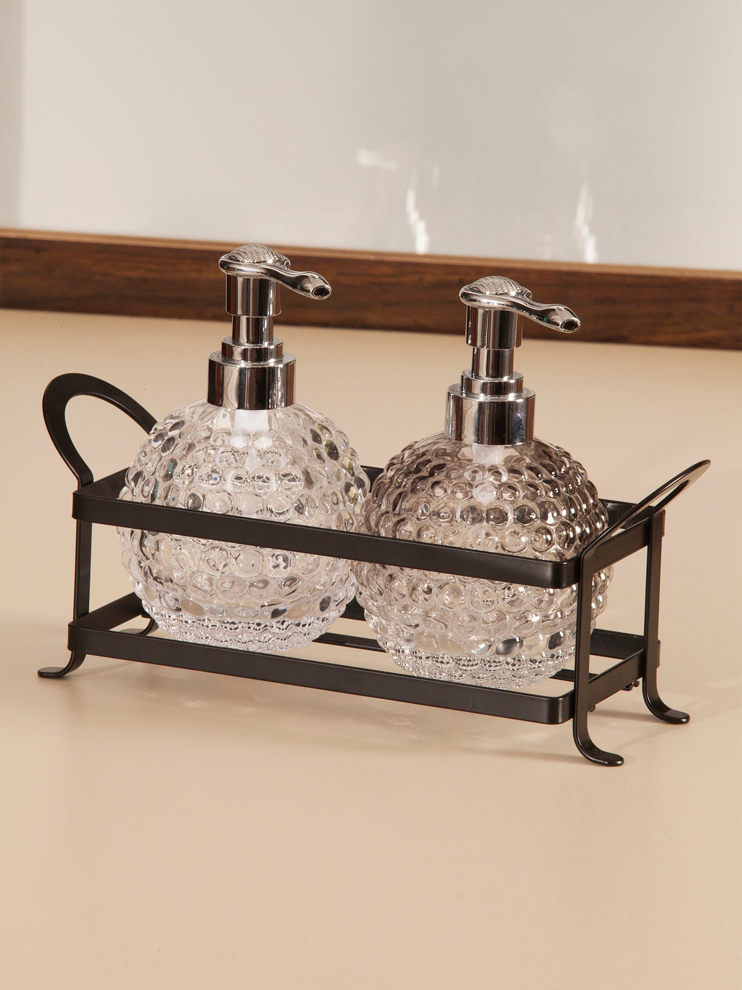 Obsessions prism glass bathroom set twin with decorative pumps in a stylish metal holder