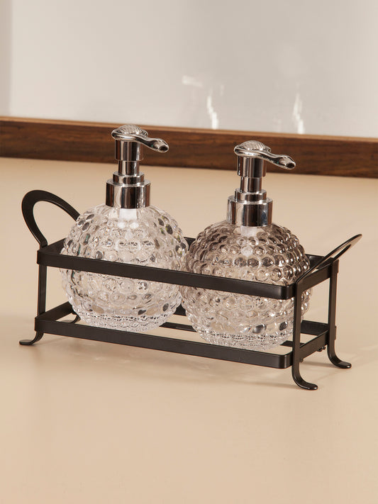 Obsessions prism glass bathroom set twin with decorative pumps in a stylish metal holder